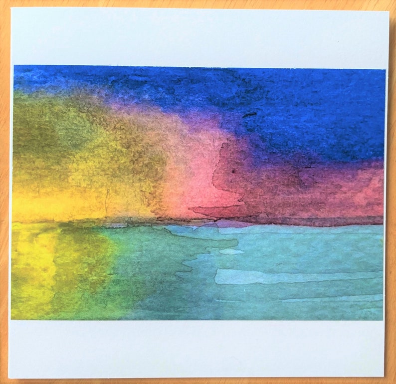 May include: Abstract watercolor painting of a sunset over a body of water. The sky is a mix of yellow, pink, purple, and blue. The water is a light blue and green.