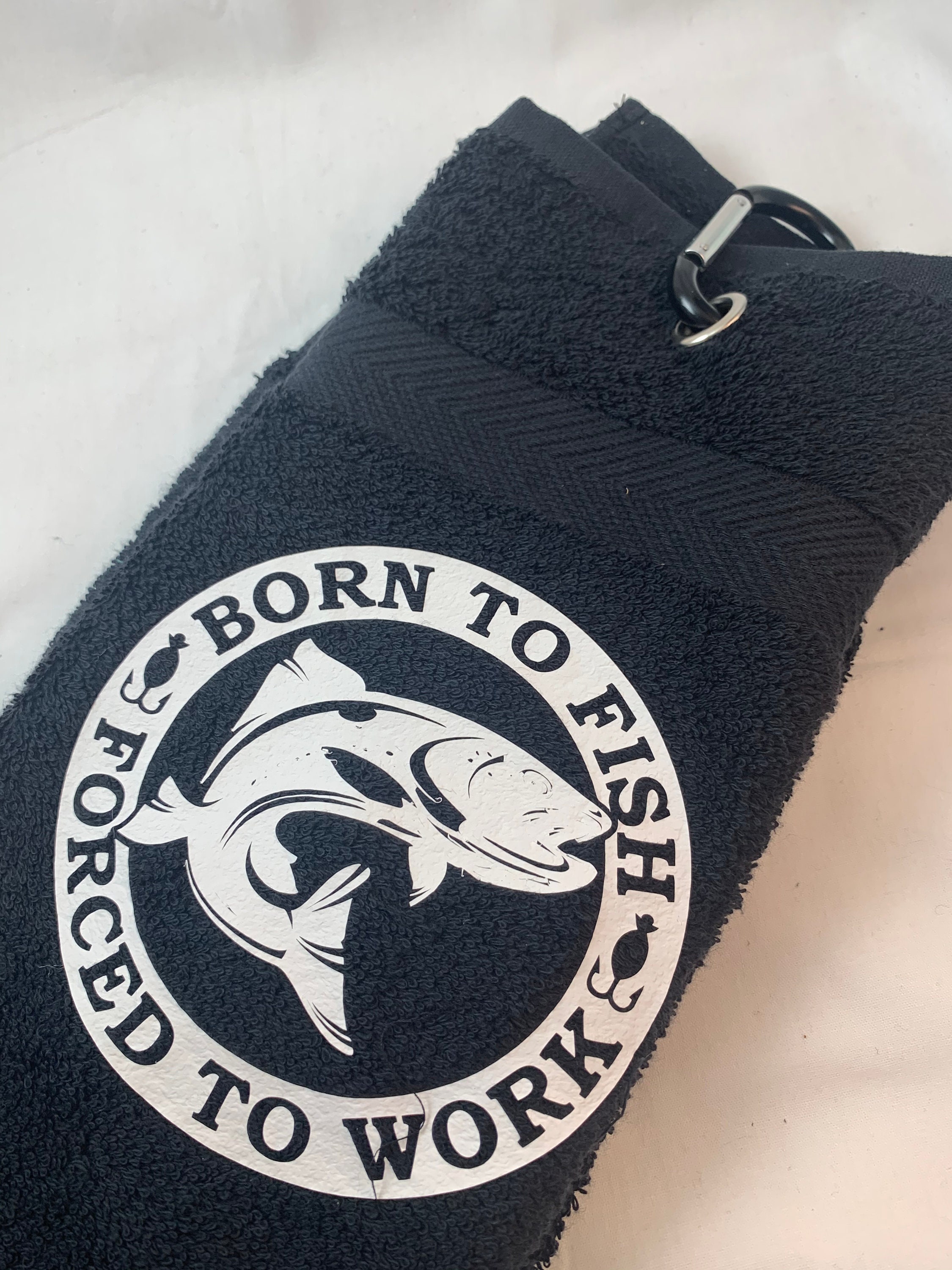 Born to Fish Forced to Work Fishing Towel With Grommet and Crabaners Clip.  Towel is Cotton 16 X 28. Great Birthday or Christmas Gift 