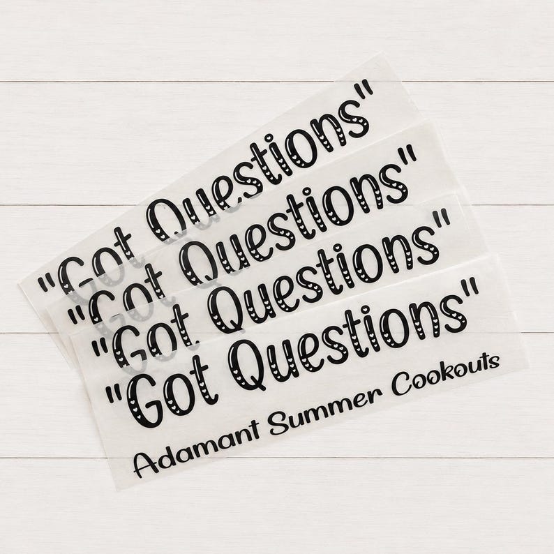 May include: A set of four clear adhesive decals featuring the black text "Got Questions" in a stylized, rounded font. The bottom decal also includes the black text "Adamant Summer Cookouts" printed in a simple, sans-serif typeface.