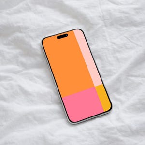 May include: A smartphone with a vibrant, abstract design. The screen features a geometric pattern of orange, pink, and yellow blocks. The phone has a silver frame and is set against a white, textured background.