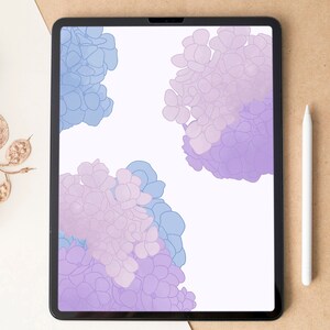 May include: A digital tablet shows a floral design in blue and purple hues. A white stylus lies next to the tablet on a brown surface. The image has a clean, modern aesthetic, ideal for digital art or design projects.
