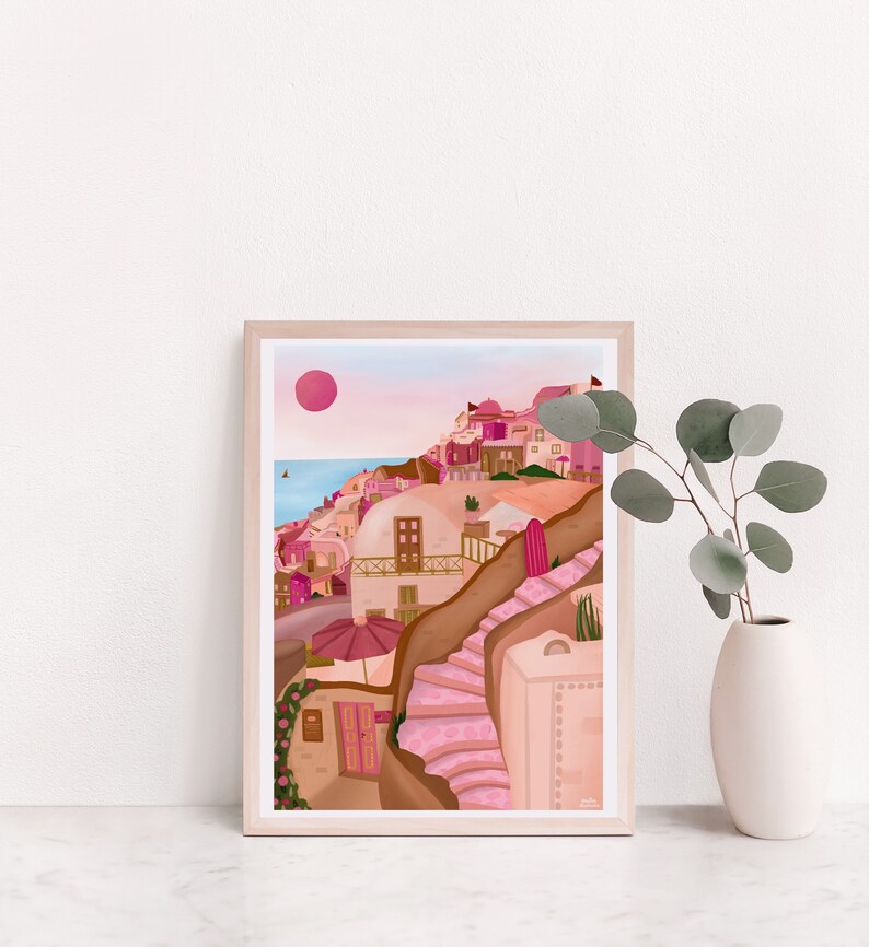 May include: A framed illustration of a pink and brown cityscape with a pink sun in the sky. The city is built on a hillside with a winding staircase leading up to the top.