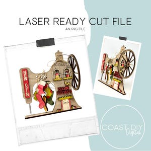 May include: A wooden laser-cut Christmas decoration in the shape of a vintage sewing machine. The decoration features a sign that says "Now Open" and "Stocking Stitchers". It includes miniature stockings and the text "Come In".