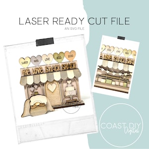 May include: Laser cut file design for a wooden love shack with a sign that says "The Love Snack Shack" and hearts with the words "Sweet", "Huss", "Love", "Kiss", and "XOXO".