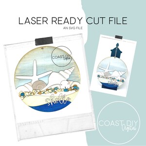 May include: A laser cut SVG file design for a round wooden ornament featuring a seashell, starfish, and the word "hello" in a blue wave. The ornament is decorated with a light blue and white watercolor background and brown and white seashells.