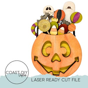May include: A wooden orange jack-o'-lantern with a smiling face, filled with Halloween-themed candies and characters. The candies include lollipops, candy corn, and round treats. The characters include a ghost, a bat, and a skeleton. The text "LASER READY CUT FILE" is at the bottom.