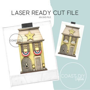Peut inclure: Un fichier de découpe laser SVG d'une maison jaune avec une bannière rouge, blanche et bleue. La maison a une étoile sur le toit et deux fenêtres avec des volets. La maison est sur une base en bois.