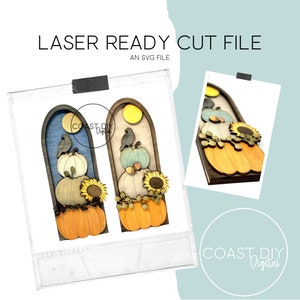 May include: Two laser-cut wooden fall decorations with a stacked pumpkin, sunflower, and birds design. The decorations are in a light wood tone with blue and brown accents. The text "COAST DIY Digital" is visible in the bottom right corner.