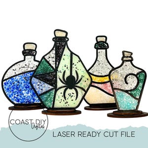 May include: A collection of four decorative potion bottles with wooden bases. The bottles feature various colors and designs, including a spider, geometric patterns, and swirling elements. The text "COAST DIY Digital" and "LASER READY CUT FILE" are visible.