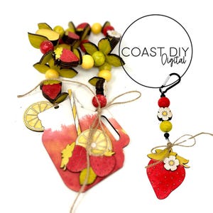 May include: A wooden craft kit featuring a red and yellow lemonade pitcher, a strawberry, and a lemon. The kit also includes a wooden bead garland with red, yellow, and green beads, and a wooden strawberry charm with a flower.
