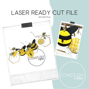 May include: A digital cut file for a bee-themed garland. The file includes a set of bees, flowers, and hexagons. The bees are black and yellow with a white stripe. The flowers are white with yellow centers and a checkered pattern. The hexagons are gold. The file is labeled "COAST DIY Digital".