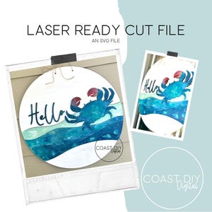 May include: A round wooden sign with a blue crab design and the word "Hello". The crab has red claws and is set against a blue and white wave pattern. The sign is labeled "LASER READY CUT FILE" and "AN SVG FILE".