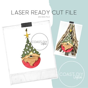 以下が含まれることがあります： サンタクロースの顔が付いたクリスマスツリーのオーナメントのレーザーカットファイル。オーナメントは木で作られており、赤、緑、茶色の配色になっています。ファイルはSVGファイルで、レーザーカッターでカットする準備ができています。