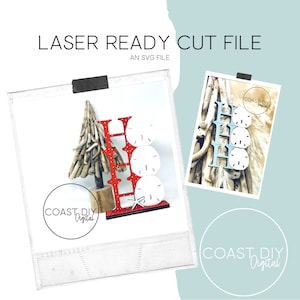May include: A red and white "HO HO HO" sign with three white sand dollars, a small driftwood Christmas tree, and a starfish. The sign is on a white background with a blue border. The text "COAST DIY Digital" is on the bottom left of the image.