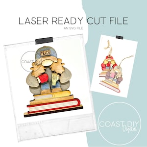May include: Laser cut SVG file of a gnome wearing a hat that says "Teach" and holding an apple and a coffee cup. The gnome is sitting on a stack of books.