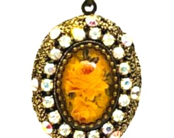 Michal Negrin Oval Locket Necklace: Vintage Floral Gilded Copper Pendant, Crystal Embellished