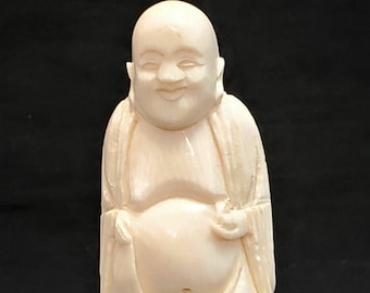 Buddha - ancient figurine On a wooden base.