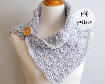 May include: A gray crocheted cowl with a wooden button. The cowl is displayed on a white mannequin. The text "pdf pattern" is written in a white circle on a gray background.