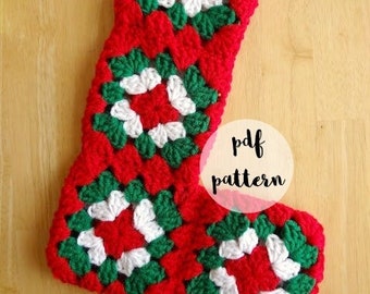 May include: Crocheted Christmas stocking in red, green, and white with a granny square pattern. The stocking has a loop at the top for hanging. The text "pdf pattern" is written in a circle on the image. The text "fiber flux" is written at the bottom of the image.