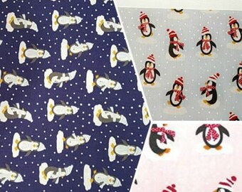 Printed Poly Cotton Fabric Dressmaking Material Crafts Printed penguins on navy blue, pink, pale blue