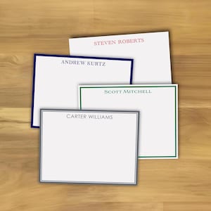 May include: Four rectangular white stationery cards with personalized names printed in the center. One card has a pink name, one has a dark blue border and name, one has a green border and name, and one has a gray border and name.