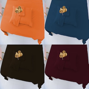 May include: Four flat sheet sets in different colors: orange, blue, black, and burgundy. Each set includes a flat sheet, fitted sheet, and pillowcases. The sheets are made of a soft, comfortable fabric.
