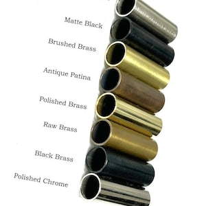 May include: An assortment of cylindrical metal tubes in different finishes: brushed chrome, matte black, brushed brass, antique patina, polished brass, raw brass, black brass, and polished chrome. Each finish is labelled with text.