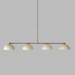 May include: A modern, four-light pendant lamp with a brass finish. The lamp features four off-white, dome-shaped shades suspended from a horizontal bar. The fixture is ideal for kitchen islands or dining areas.