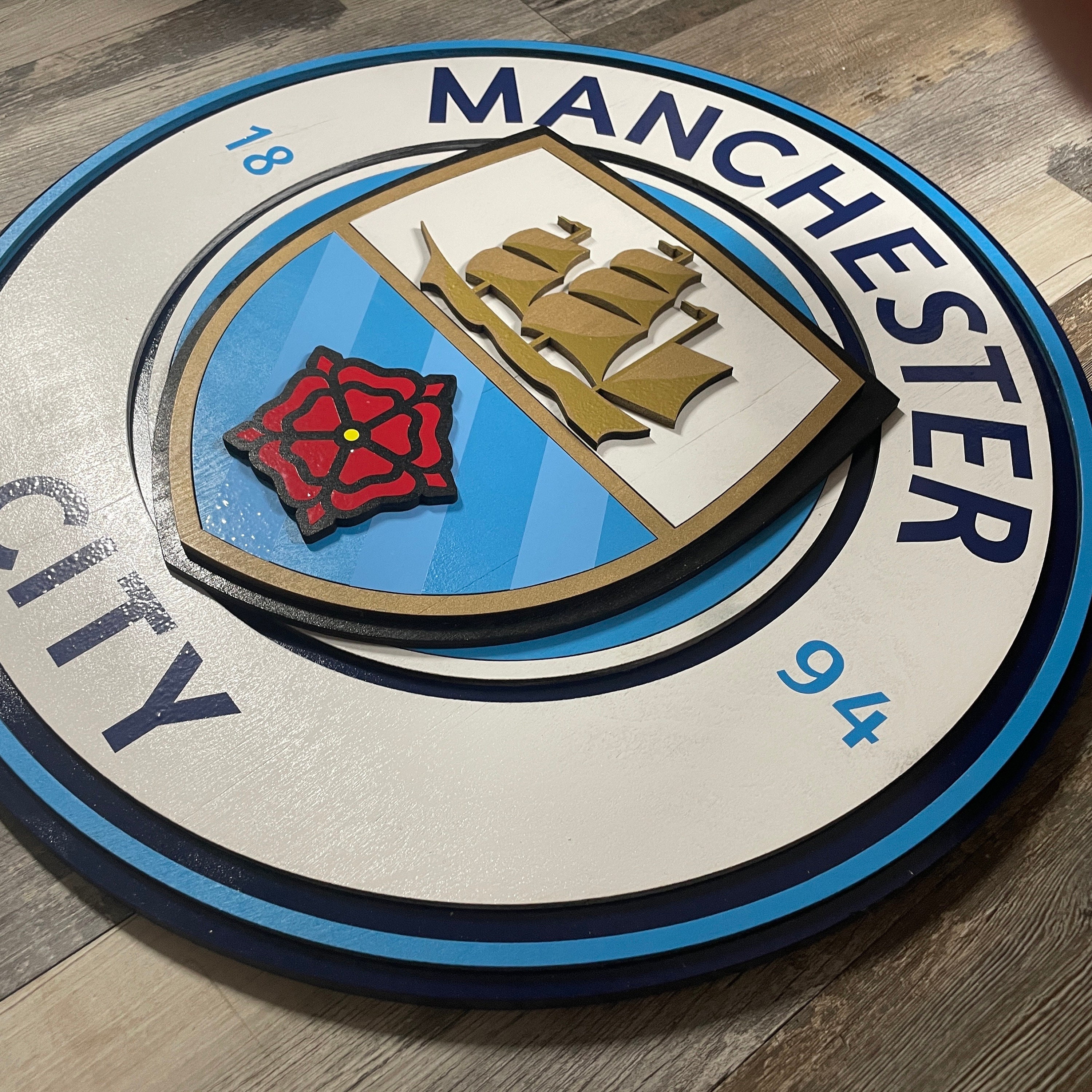 Male Hand Holds Badge Emblem Manchester City Football Club Blue