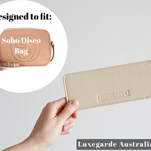 May include: Beige leather bag insert with the text "Luxegarde" embossed on it. Designed to fit a Soho Disco Bag.