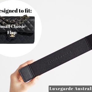 May include: Black felt strap with the text "Luxegarde" embossed on it. Designed to fit a Small Classic Flap bag.