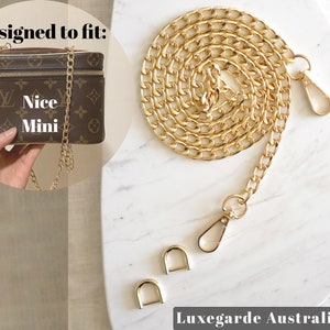 May include: Gold chain bag strap with two gold clasps and a gold lobster clasp. Designed to fit the "Nice Mini" bag.