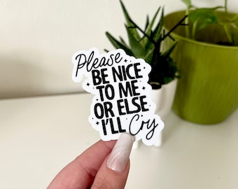 May include: White sticker with black text that reads "Please be nice to me or else I'll cry".