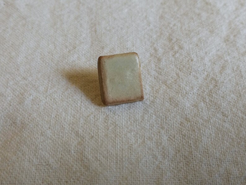 Beige handmade ceramic buttons; square knitting crochet with shank sewing