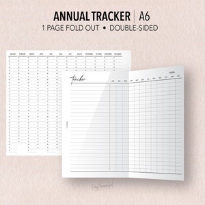 May include: A black and white printable A6 annual tracker with a fold-out design. The front side features a calendar grid for each month of the year. The back side has a blank grid for notes and a section for a yearly tracker.