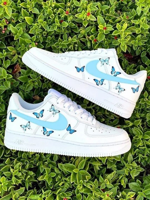 white vans with blue butterflies