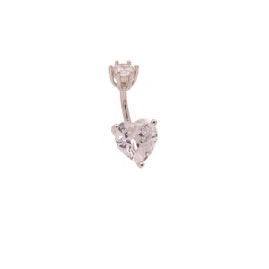 May include: A silver belly button ring with a clear heart-shaped gem and a smaller clear round gem at the top.