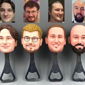 May include: Five bottle openers with different faces on the top. The bottle openers are black metal with a silver bottle opener.