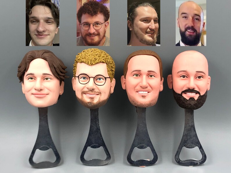 May include: Five bottle openers with different faces on the top. The bottle openers are black metal with a silver bottle opener.