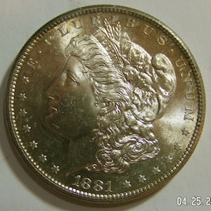 1881 S Morgan uncirculated dollar. Slight obverse color tint. Free shipping. 1881S. Lot 527