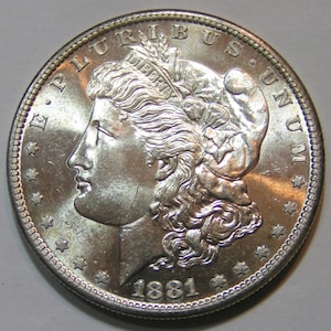 1881 S Morgan uncirculated dollar. Reflective reverse field. Free ship. 1881S. Lot 548