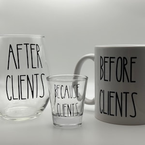 May include: Set of three clear glass drinkware with black text. The wine glass says "After Clients", the shot glass says "Because Clients", and the mug says "Before Clients".