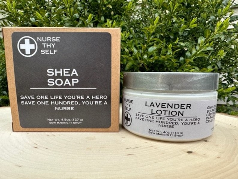 May include: Two jars of body care products with a white background and black text. The jar on the left is labeled "Shea Soap" and the jar on the right is labeled "Lavender Lotion". Both jars have the text "Save one life you're a hero, save one hundred, you're a nurse" and the logo "Nurse Thy Self" with a red cross.
