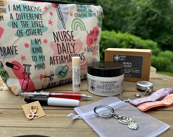 May include: A gift bag filled with self-care items for nurses. The bag is white with pink, green, and blue patterns and has the text "Nurse Daily Affirmations" printed on it. The bag contains a lavender lotion, shea soap, lip balm, a stethoscope pin, a keychain with an angel charm, and two colorful bracelets.