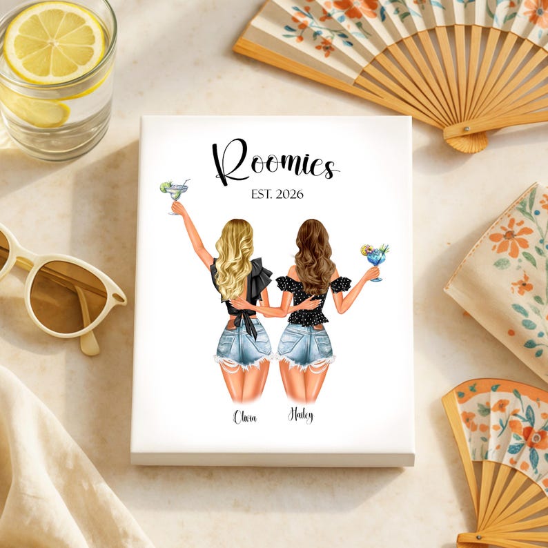 May include: A white canvas print featuring two women with cocktails, the word "Roomies" and the year "EST. 2026". The women are depicted in denim shorts and black tops. The names "Olivia" and "Haley" are below the figures. Decorative fans and sunglasses are in the background.