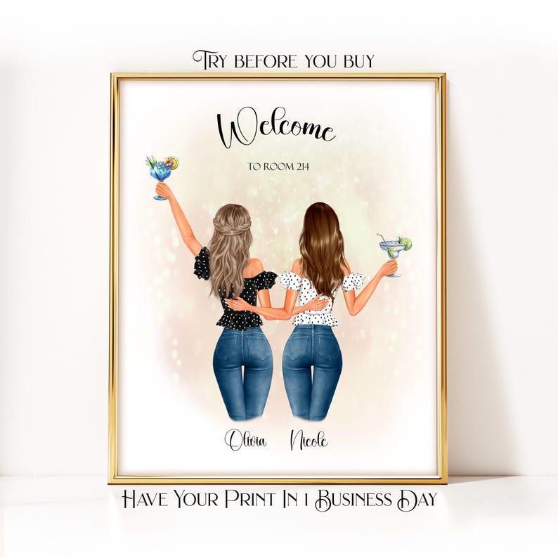 May include: A framed print with a gold border features two illustrated women in jeans and tops, holding cocktails. The text "Welcome to Room 214" is above their heads, with the names "Olivia Nicole" below. The print also includes the text "Try Before You Buy" and "Have Your Print in 1 Business Day."