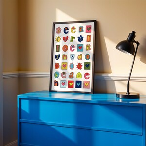 May include: A framed print with a white background and colourful letters, each letter is surrounded by a different design, such as a heart, a star, or a flower. The letters spell out "I love you".