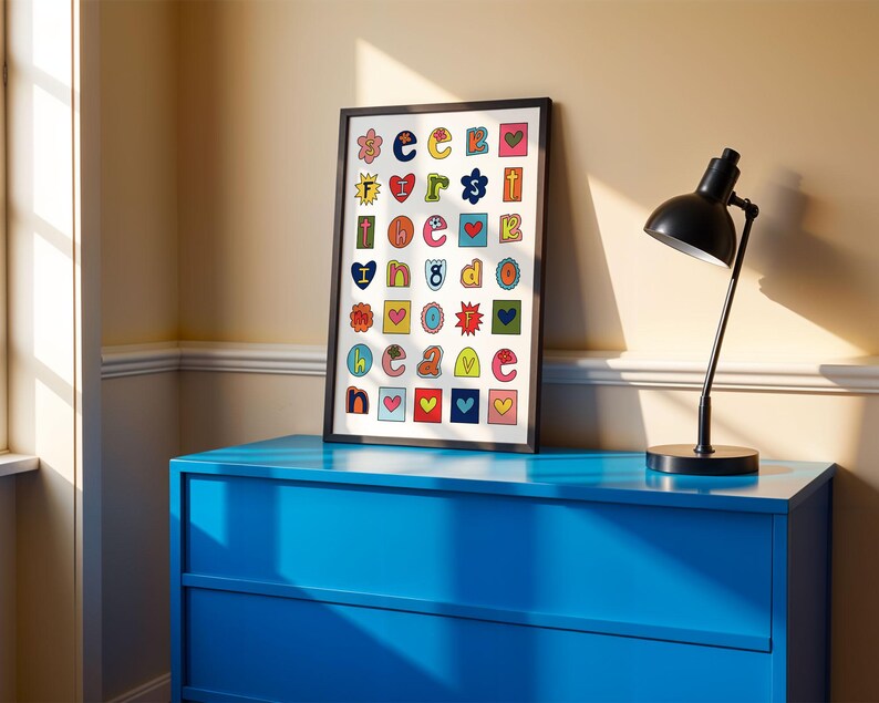 May include: A framed print with a white background and colourful letters, each letter is surrounded by a different design, such as a heart, a star, or a flower. The letters spell out "I love you".