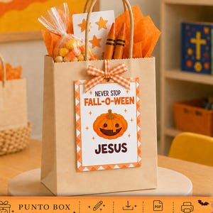 May include: A brown paper gift bag filled with orange tissue paper, a clear plastic bag of candy corn, two orange crayons, and a white card with orange star cutouts. A tag attached with an orange gingham bow reads NEVER STOP FALL-O-WEEN JESUS.
