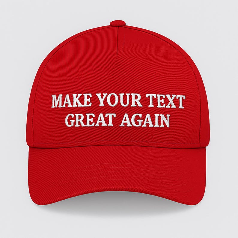 May include: A red baseball cap with white embroidered text reading "MAKE YOUR TEXT GREAT AGAIN". The cap features a curved peak and a button on top. This hat is a statement piece.
